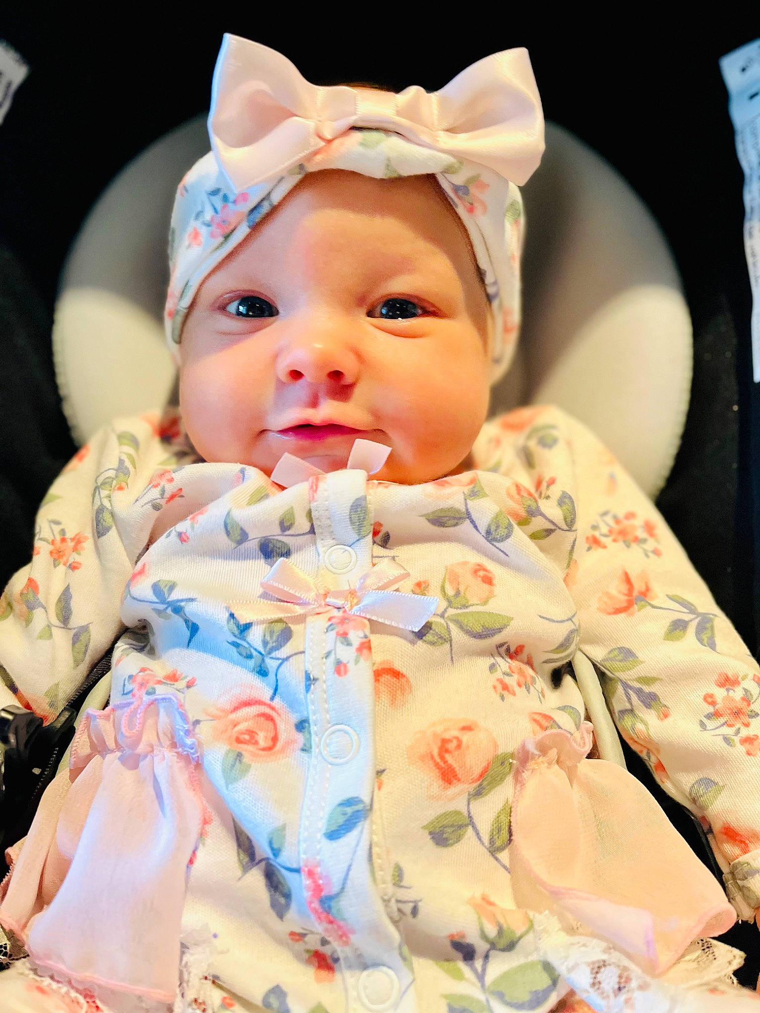 Zelda is registered to the contest to win money with this photo: baby, baby_toddler_clothing, cheek, chin, eye, face, happy, hat, head, headgear, headwear, human_body, iris, lip, outerwear, person, pink, skin, sleeve, smile