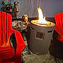 animal, backyard, canine, chair, dog, fire, fire_pit, furniture, glow, leisure, night, orange_chair, outdoor, pet, plants, relaxing, spot, spotted_dog, table, warmth