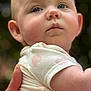baby, background_blur, child, closeup, clothing, curious, cute, expression, face, hand, holding, infant, nail, nature, outdoor, person, portrait, short_sleeve, skin, soft_light