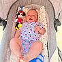 baby, blanket, child, comfortable, cushion, cute, feet, heart_pattern, indoor, infant, legs, minnie_mouse, plush_toy, quilted, relaxed, shirt, shorts, smiling, soft_toy, stroller