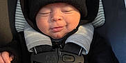 Kingsley joined the competition — help win amazing prizes! baby, beanie, black_clothing, car_seat, child, closed_eyes, cozy, cute, hand, headwear, infant, jacket, newborn, portrait, safety_harness, seatbelt, sleeping, smile, winter_clothing, young