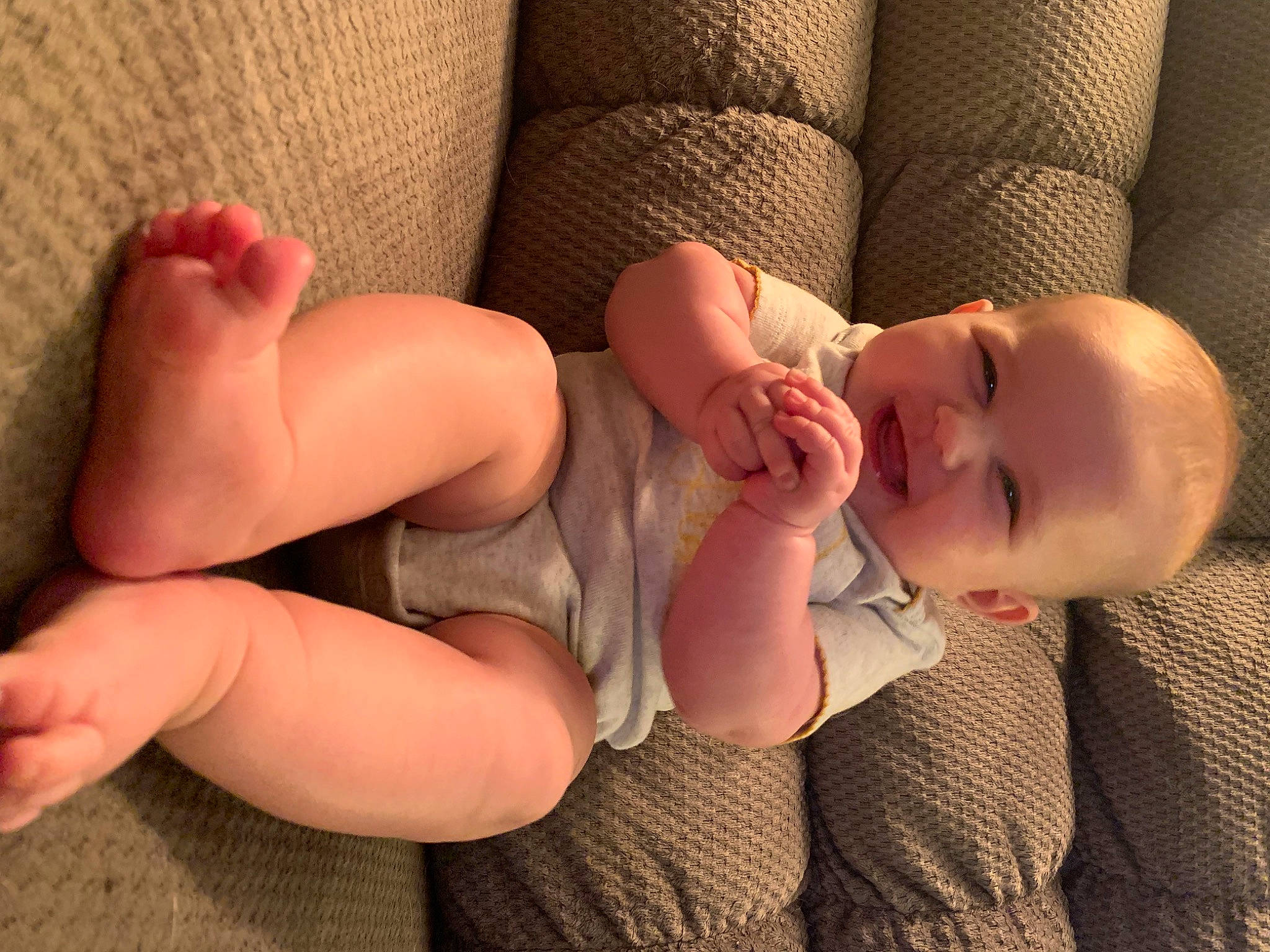 Violet is registered to the contest to win money with this photo: arm, baby, baby_toddler_clothing, barefoot, child, comfort, finger, foot, gesture, hand, human_body, human_leg, knee, leg, muscle, nail, person, skin, thigh, thumb
