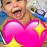 Joseph is registered to the contest to win money with this photo: toddler, child, bath, water, smile, happy, indoor, blue_tub, bathtub, face, wet_skin, joy, emotion, cute, playful, pink_heart_emoji, sparkles, shower_head, bathroom, personal_care