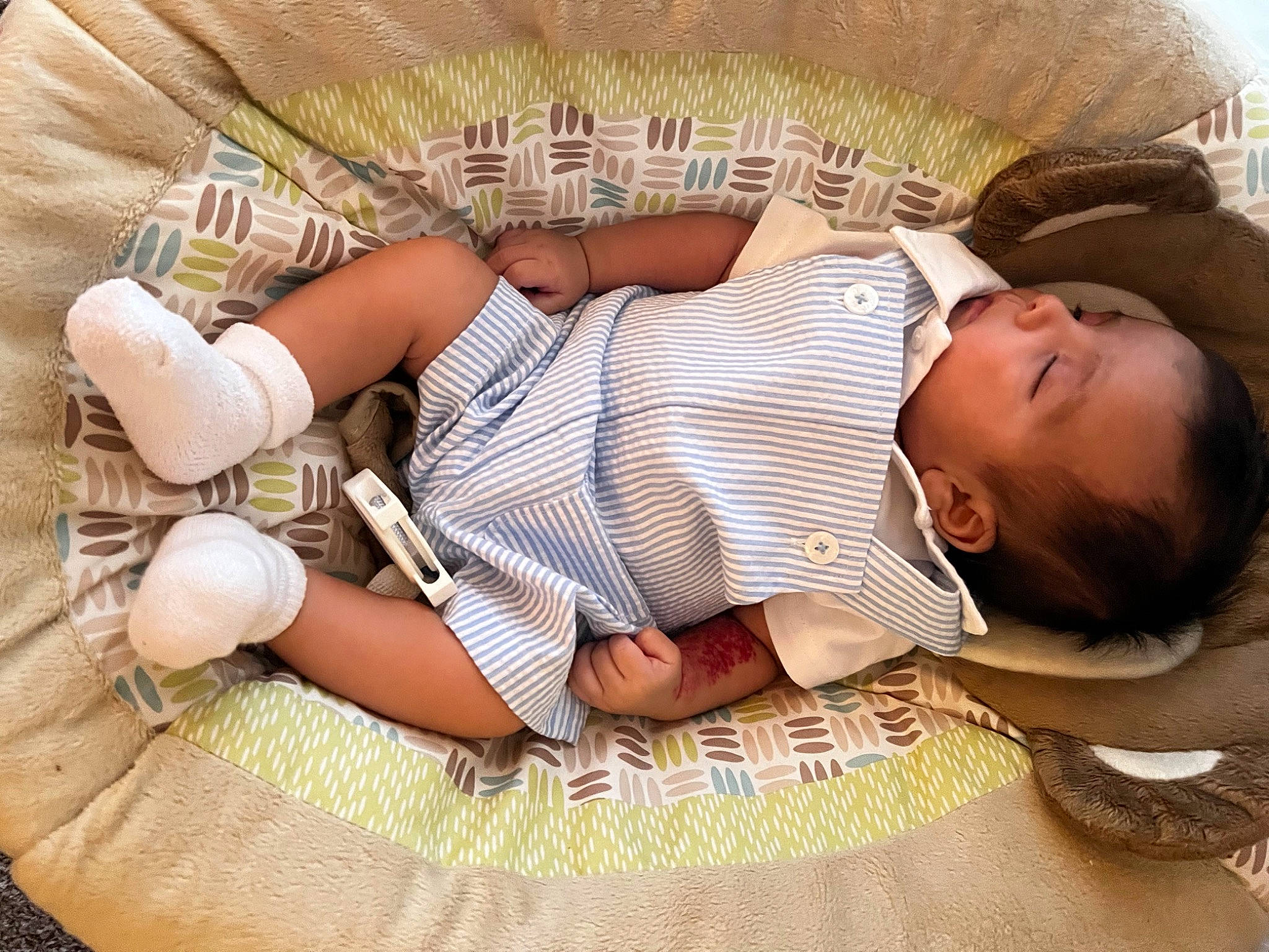Nickolas is registered to the contest to win money with this photo: baby, baby_products, baby_sleeping, baby_toddler_clothing, bedtime, child, comfort, couch, hand, happy, human_body, human_leg, linens, nap, pattern, person, sitting, textile, thigh, toddler