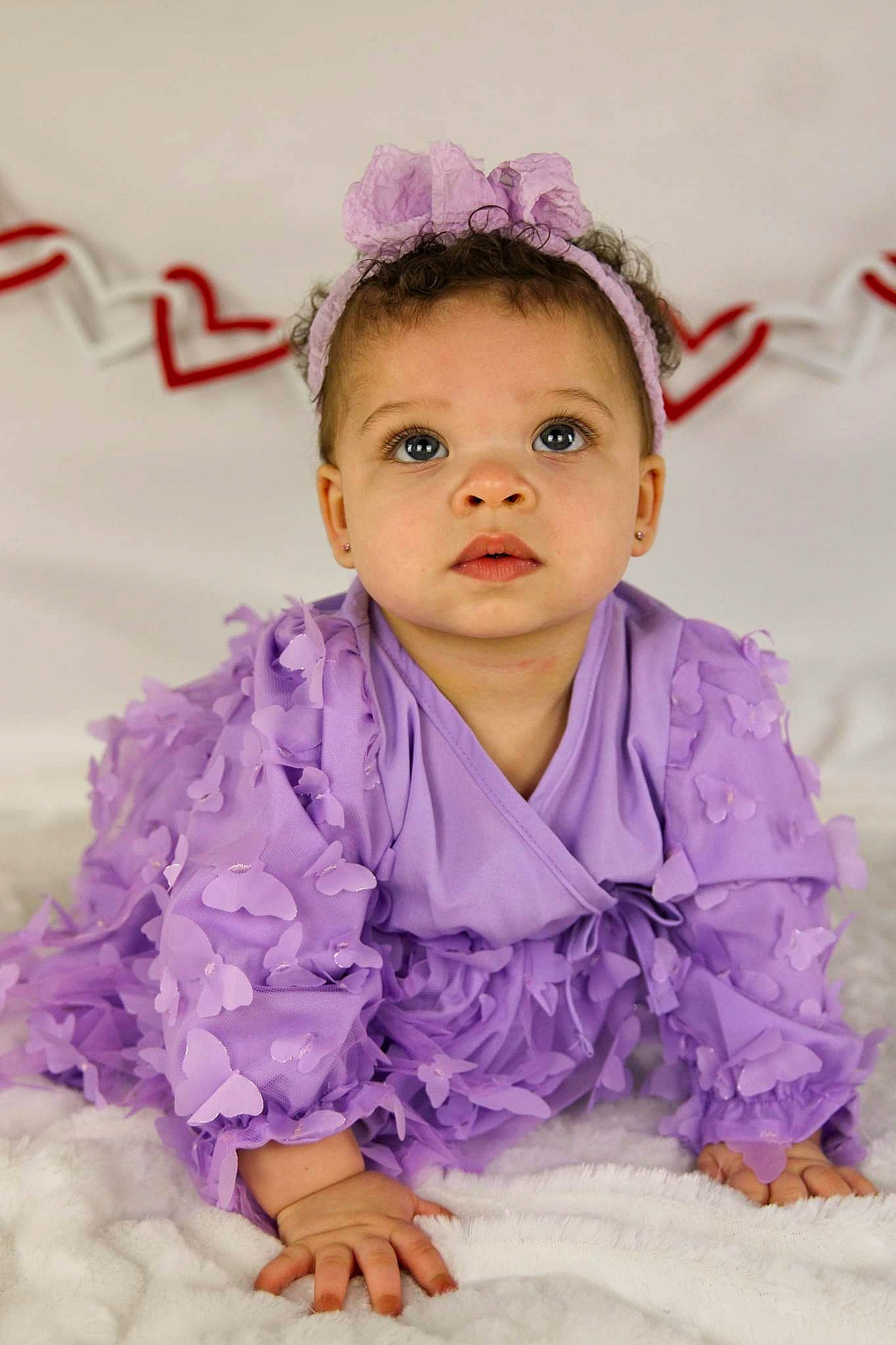 Avani is registered to the contest to win money with this photo: baby, baby_toddler_clothing, child, dress, event, fashion_accessory, fun, hair_accessory, happy, headband, headpiece, iris, jewellery, magenta, person, petal, pink, purple, sleeve, toddler