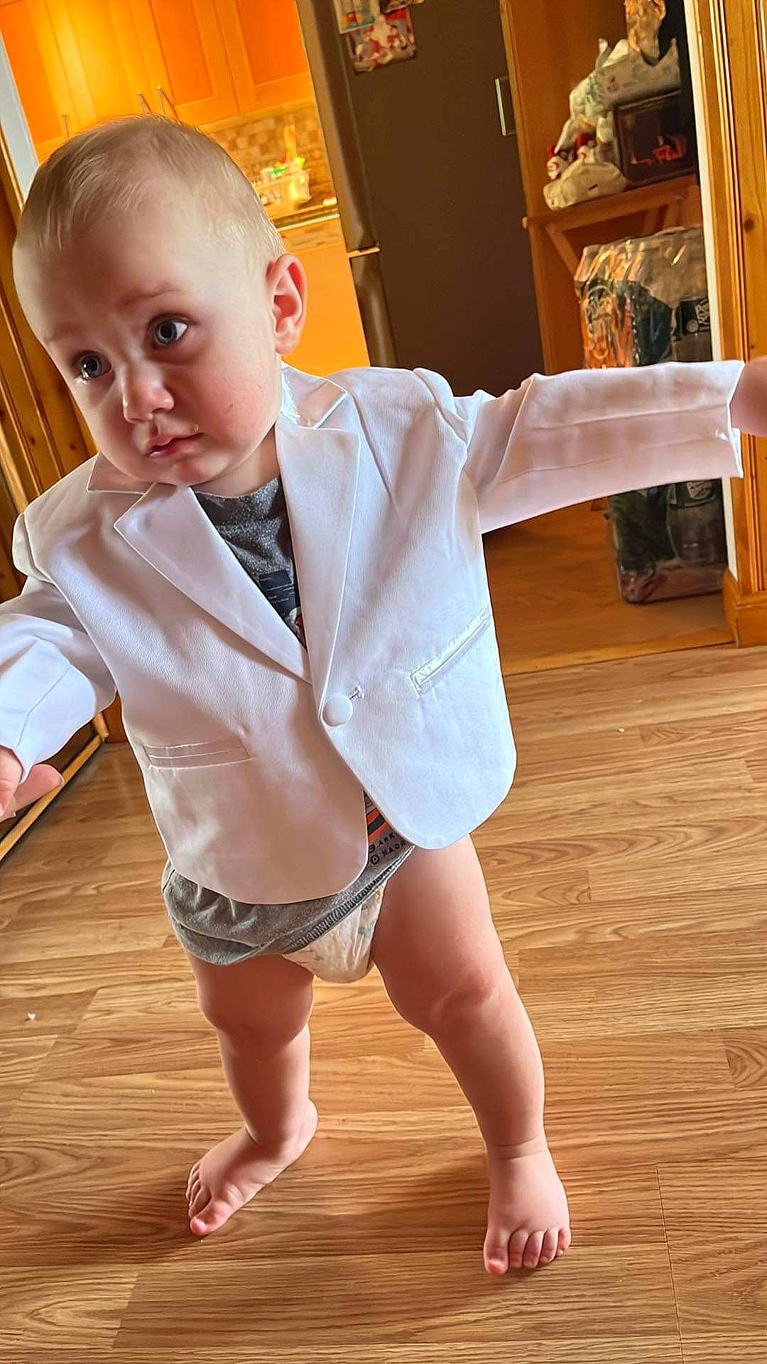 Lucas joined the competition — help win amazing prizes! baby_toddler_clothing, face, finger, floor, flooring, hair, hairstyle, head, human_body, joint, knee, leg, muscle, neck, person, shoulder, skin, sleeve, sock, thigh