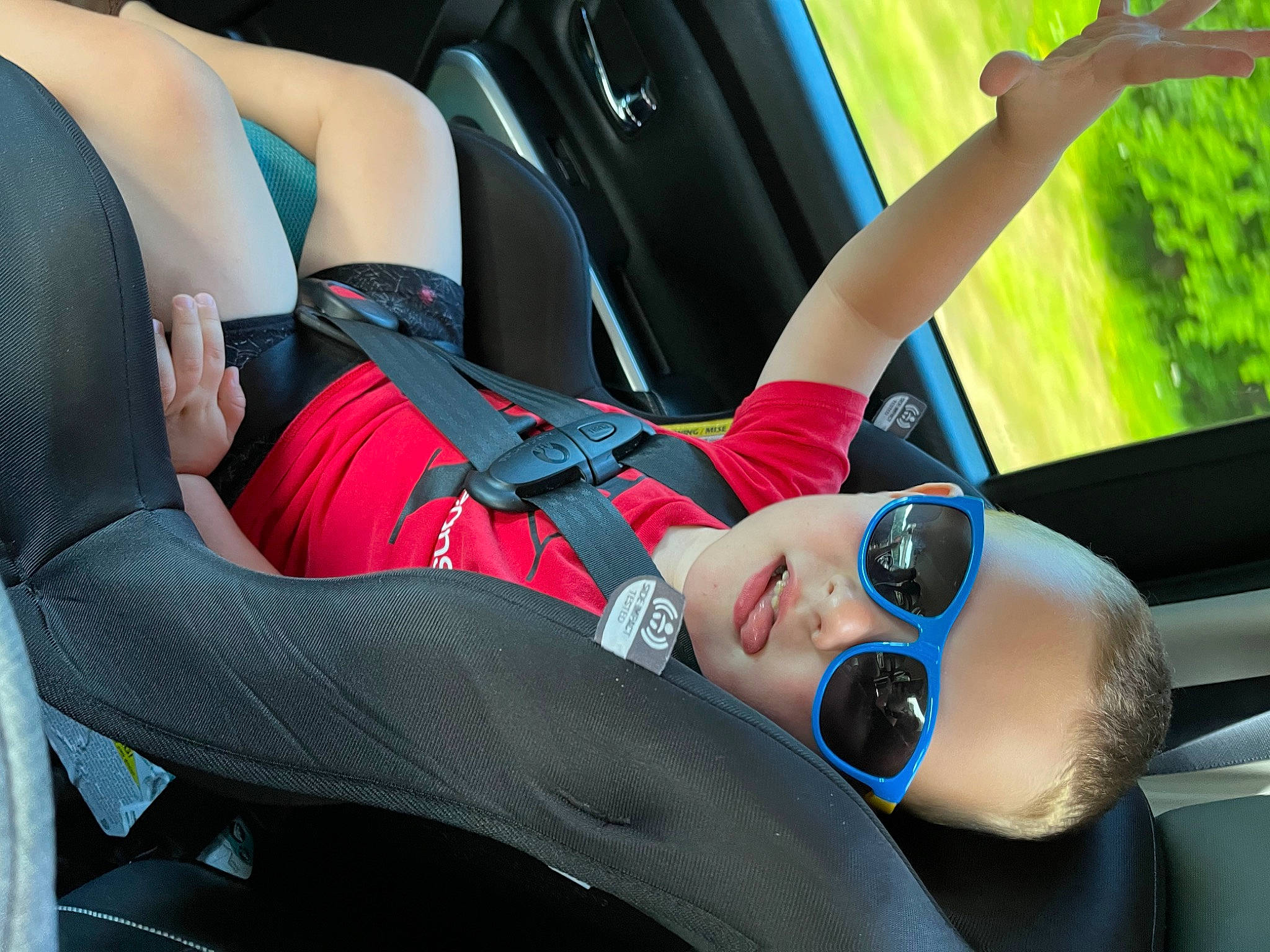 Miko?aj joined the competition — help win amazing prizes! auto_part, automotive_design, black_hair, car, comfort, elbow, eyewear, finger, goggles, human_leg, knee, leg, leisure, motor_vehicle, person, plant, recreation, sunglasses, thigh, tree