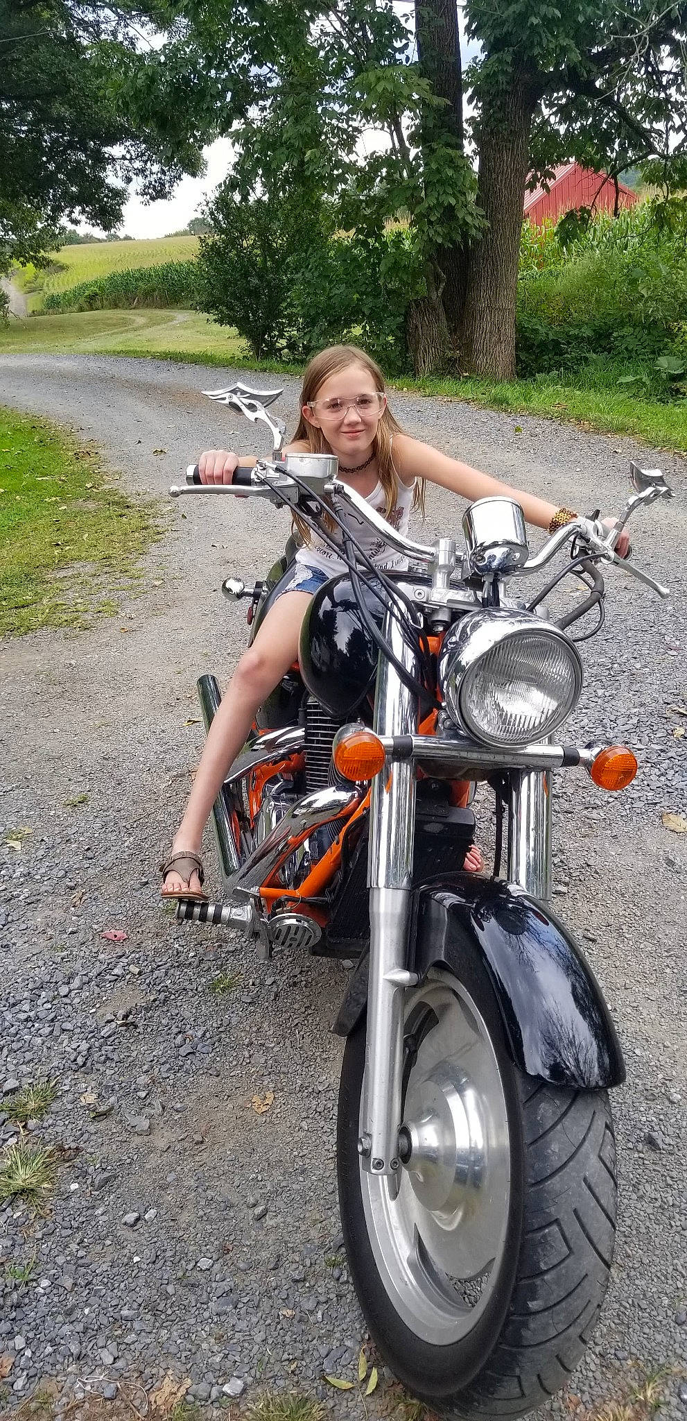 Vivianna is registered to the contest to win money with this photo: auto_part, automotive_lighting, automotive_tire, bicycle_handlebar, car, cruiser, joy, land_vehicle, motor_vehicle, motorcycle, motorcycle_accessories, person, rim, spoke, vehicle, wheel