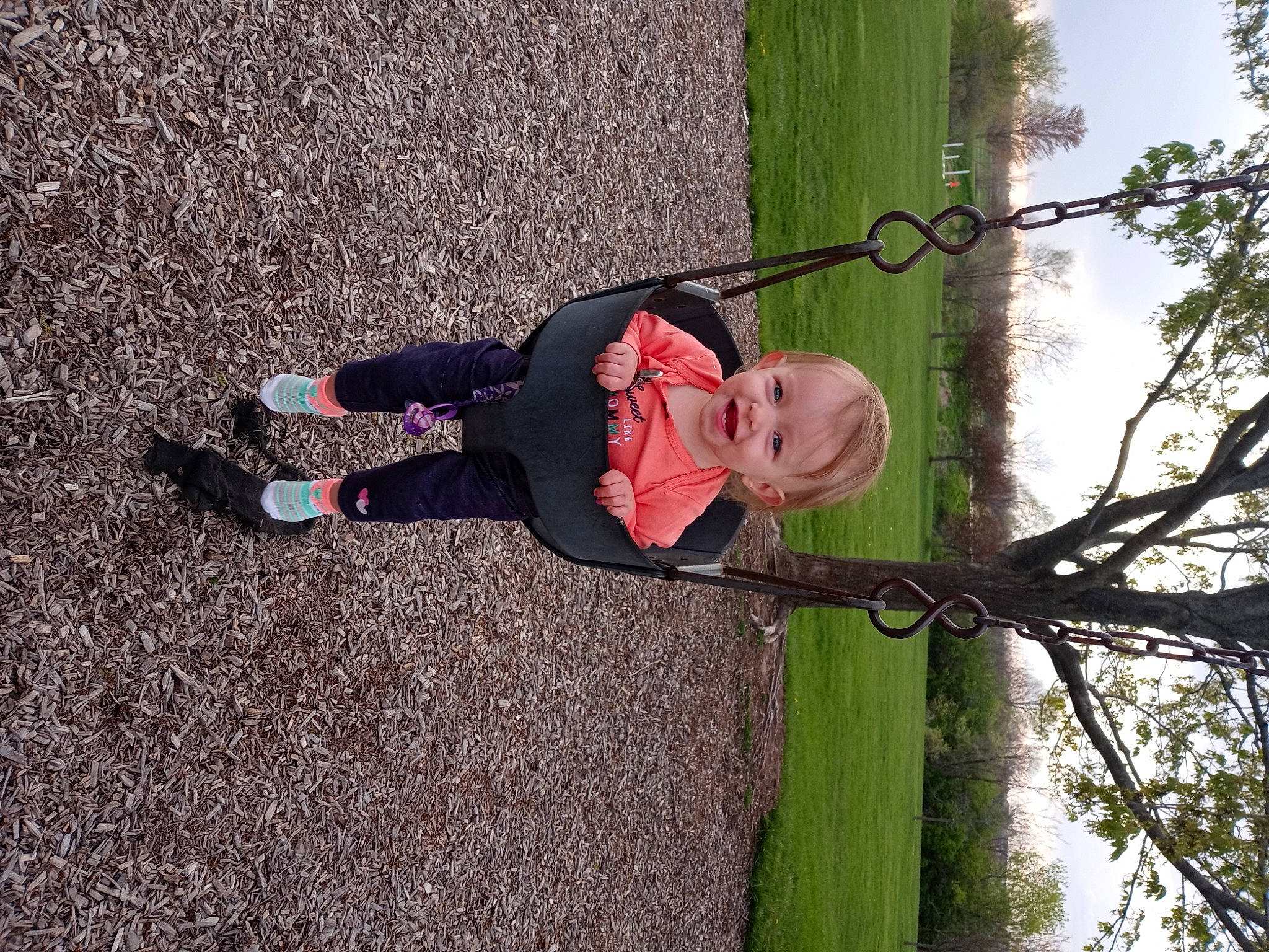 Hazel joined the competition — help win amazing prizes! asphalt, child, clothing, footwear, fun, grass, happy, joy, leisure, people_in_nature, person, plant, recreation, shadow, sky, smile, sneakers, toddler, tree, trunk