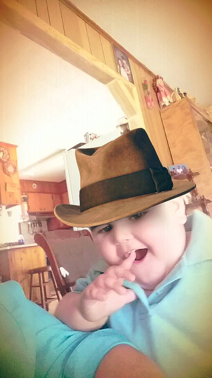 Scott is registered to the contest to win money with this photo: cowboy_hat, fashion_accessory, fedora, hat, headgear, headwear, person, selfie