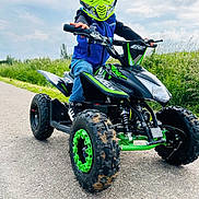 Liam a rejoint le concours — aidez-le/la à gagner de superbes lots ! atv, boy, child, clothing, face, grass, hardhat, head, helmet, machine, male, motorcycle, outdoors, person, plant, spoke, tire, transportation, vehicle, wheel