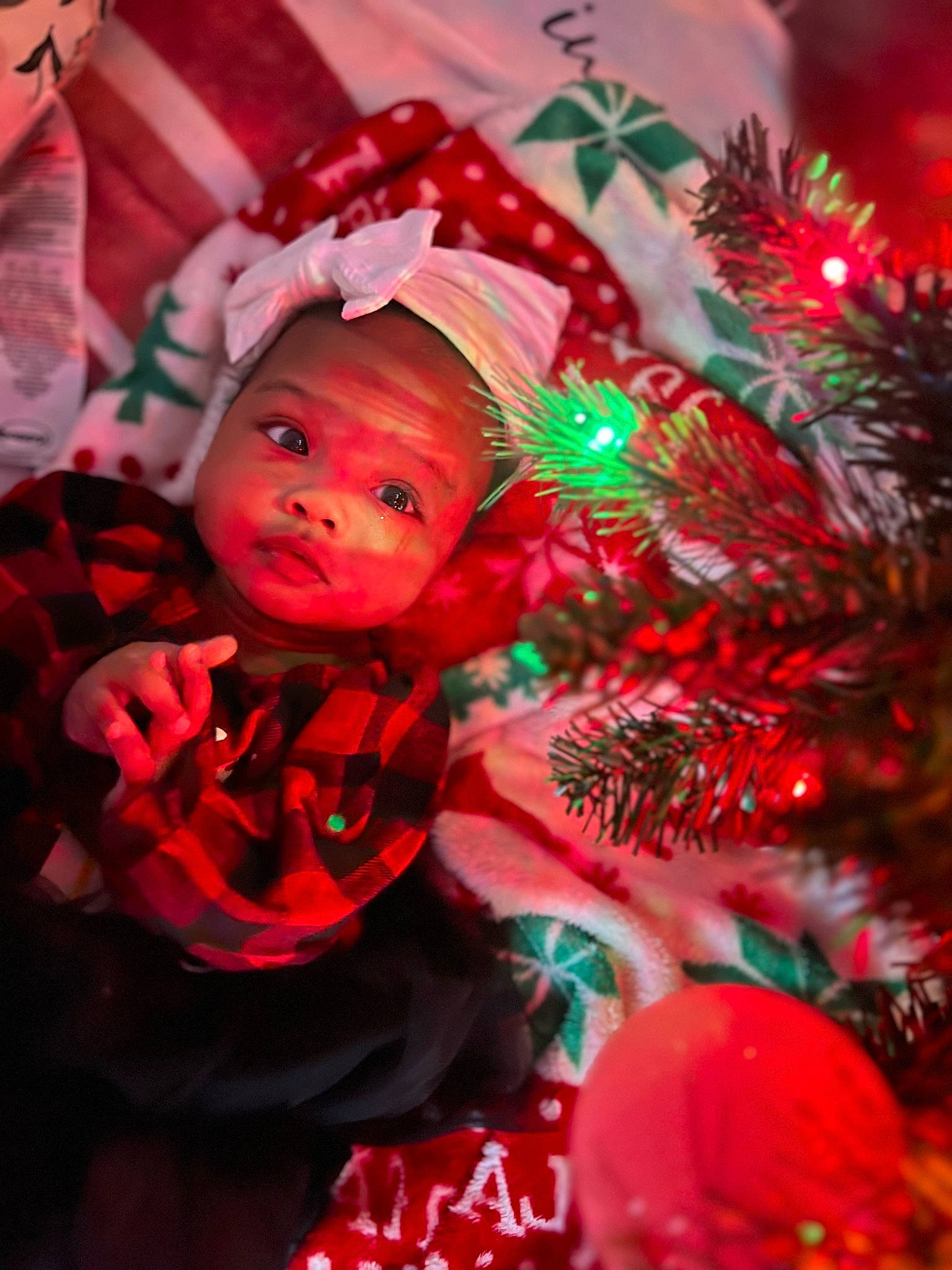 Alaïa joined the competition — help win amazing prizes! baby, baby_toddler_clothing, christmas, christmas_decoration, christmas_eve, christmas_ornament, christmas_tree, conifer, event, evergreen, happy, headwear, holiday, holiday_ornament, light, ornament, person, plant, red, toddler