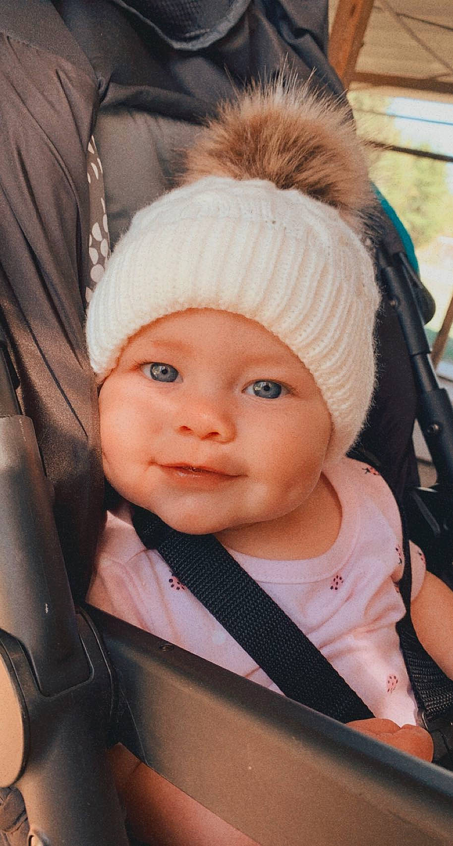 Phoebe joined the competition — help win amazing prizes! baby, blond, cap, cheek, child, dress, eyebrow, eyelash, fashion_accessory, fun, happy, headwear, human, human_body, knit_cap, lip, nose, outerwear, person, skin