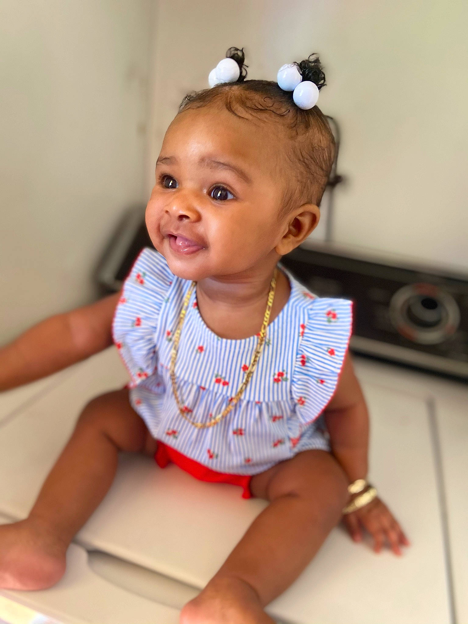 Alayla is registered to the contest to win money with this photo: baby, baby_toddler_clothing, child, ear, fashion_accessory, hair_accessory, hair_tie, headband, headpiece, mouth, person, sock, toddler