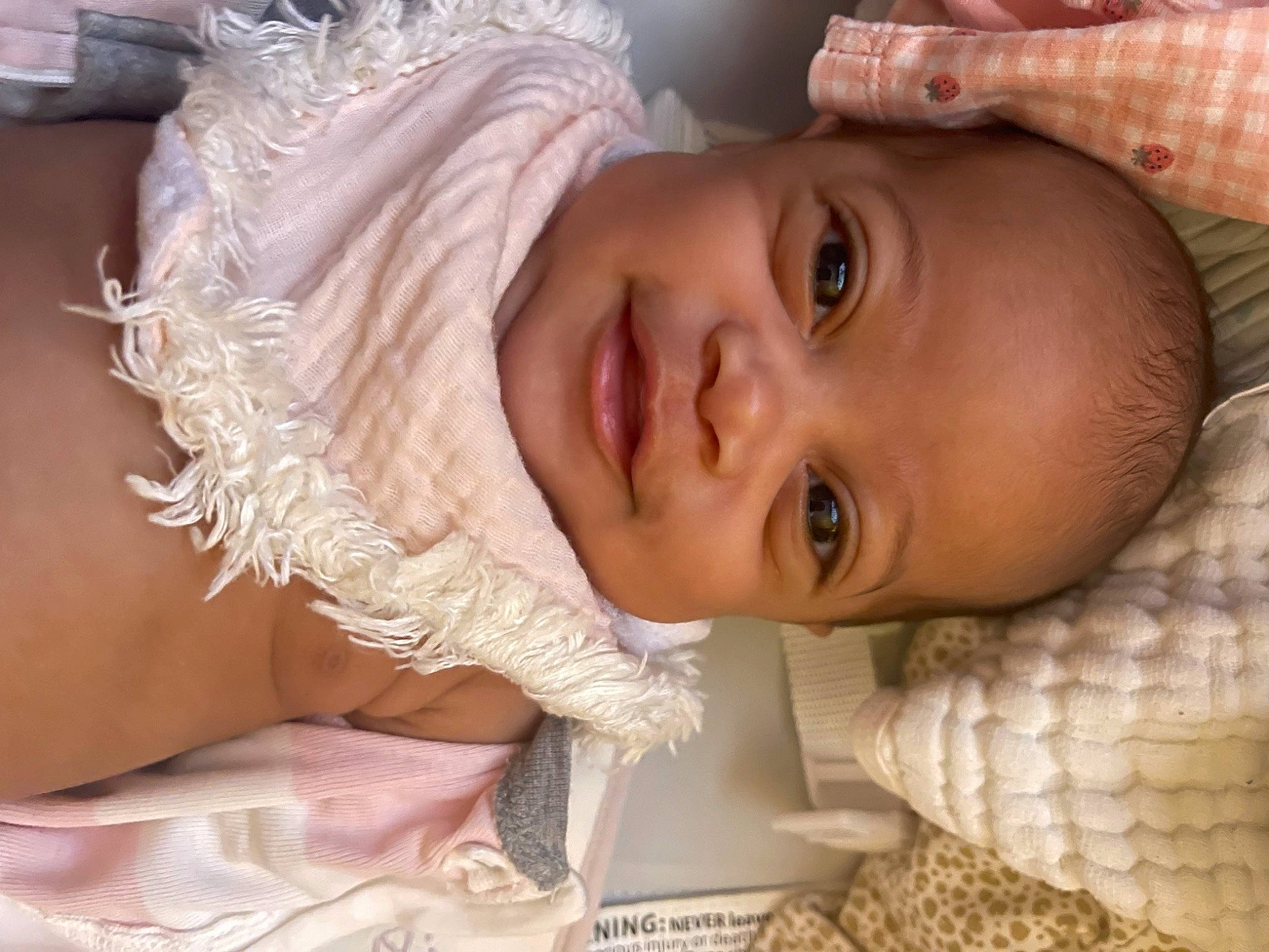 Calliopé is registered to the contest to win money with this photo: baby, cheek, chest, child, comfort, ear, eyebrow, eyelash, fashion_accessory, happy, headpiece, human_body, iris, lip, mouth, neck, nose, person, skin, smile