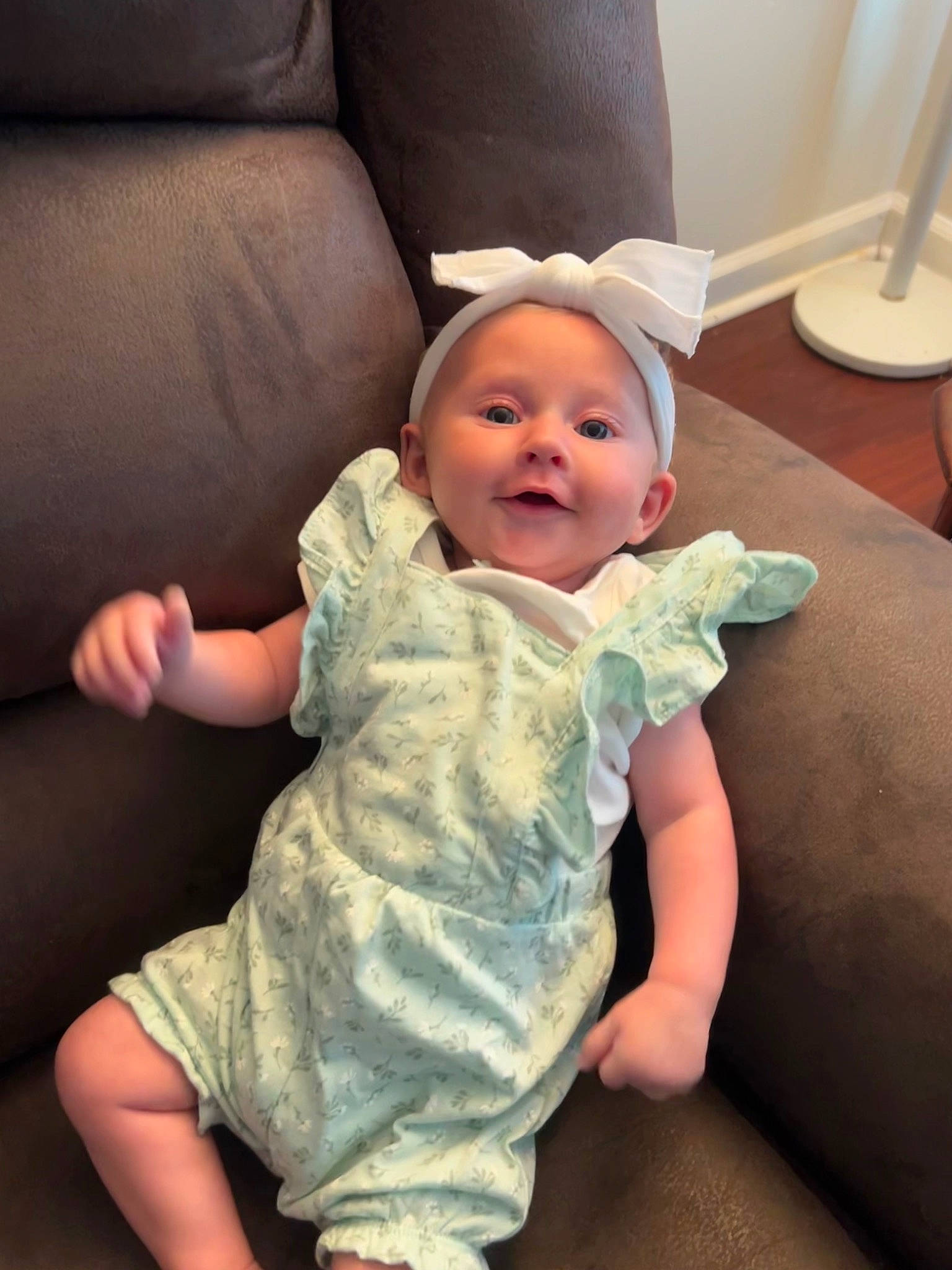 Jennifer is registered to the contest to win money with this photo: baby, baby_toddler_clothing, cheek, comfort, couch, eye, face, facial_expression, finger, fun, gesture, hairstyle, head, mouth, person, sitting, skin, sleeve, smile, thumb