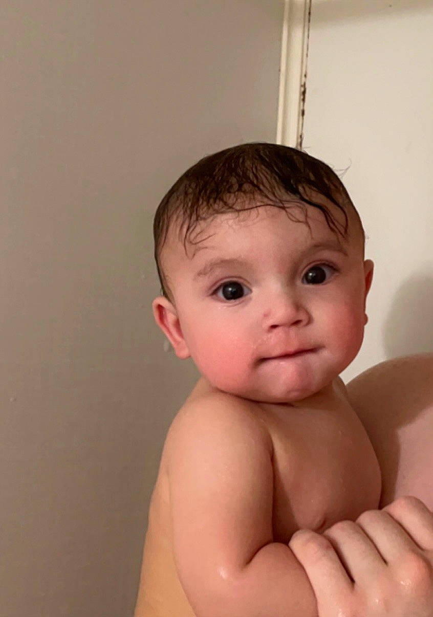 Christopher is registered to the contest to win money with this photo: baby, bathing, cheek, chest, child, close_up, elbow, eye, eyelash, gesture, hand, head, iris, lip, nail, neck, person, skin, stomach, thumb