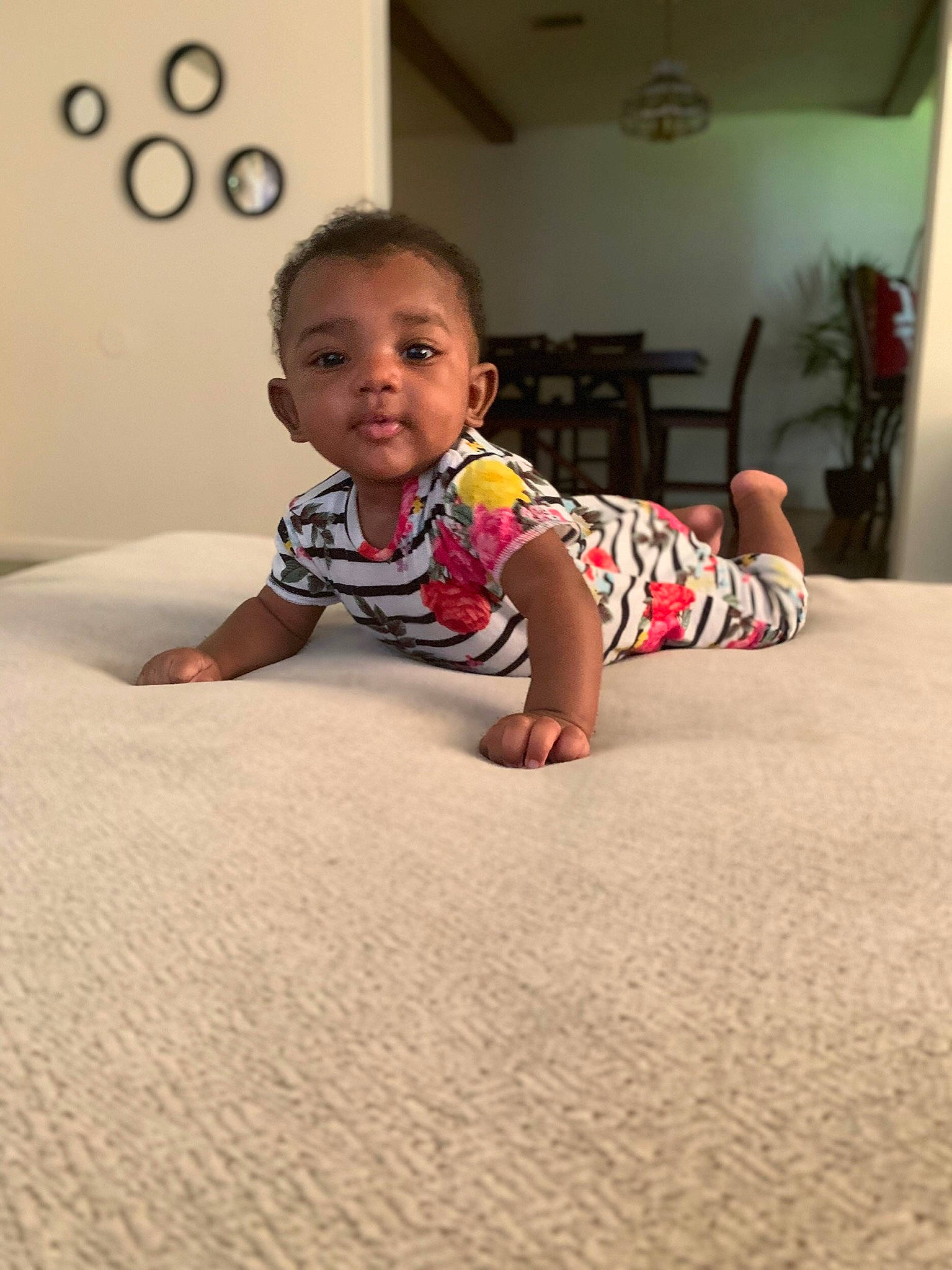 Avionna is registered to the contest to win money with this photo: baby, carpet, child, crawling, floor, flooring, fun, head, home, person, play, room, sitting, skin, smile, toddler, vacation