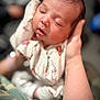 baby, child, closeup, cozy, cute, face, hand, human, infant, newborn, onesie, peaceful, person, portrait, resting, skin, sleeping, soft_lighting, tiny, warm