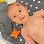 baby, bathtub, bath_toys, child, cute, face, happy, infant, mat, orange_toy, person, play, plastic_toys, rubber_duck, smile, toddler, toy_turtle, water, yellow_toy, young_child