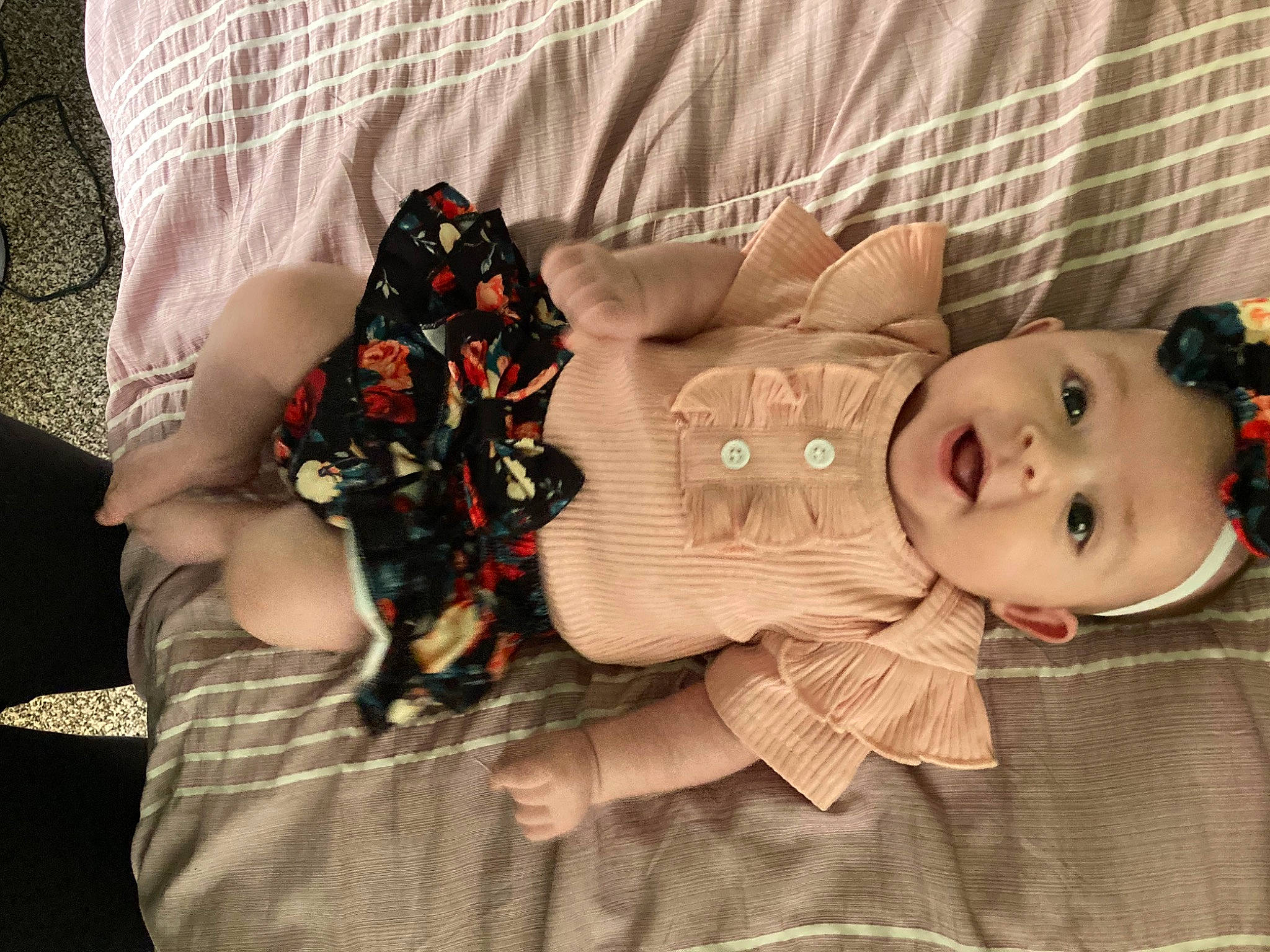 Astrid is registered to the contest to win money with this photo: baby, baby_products, baby_toddler_clothing, button, child, comfort, doll, dress, eyelash, fashion_accessory, pattern, person, room, sitting, skin, sleeve, textile, toddler, toy, wood