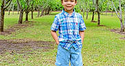 Mayson joined the competition — help win amazing prizes! child, boy, smiling, standing, outdoor, greenery, trees, grass, plaid_shirt, shorts, sandals, nature, park, sunny, happy, portrait, casual_clothing, young, daylight, person