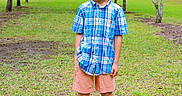 Memphis joined the competition — help win amazing prizes! boy, casual_clothing, child, daylight, grass, greenery, happy, nature, outdoor, park, person, plaid_shirt, portrait, shorts, smiling, sneakers, standing, summer, trees, young