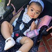 Mylah joined the competition — help win amazing prizes! baby, infant, stroller, car_seat, bottle, headband, flower, white_shoes, outdoor, brick_floor, curious, straps, cute, child, person, portrait, clothing, seat, footwear, baby_girl
