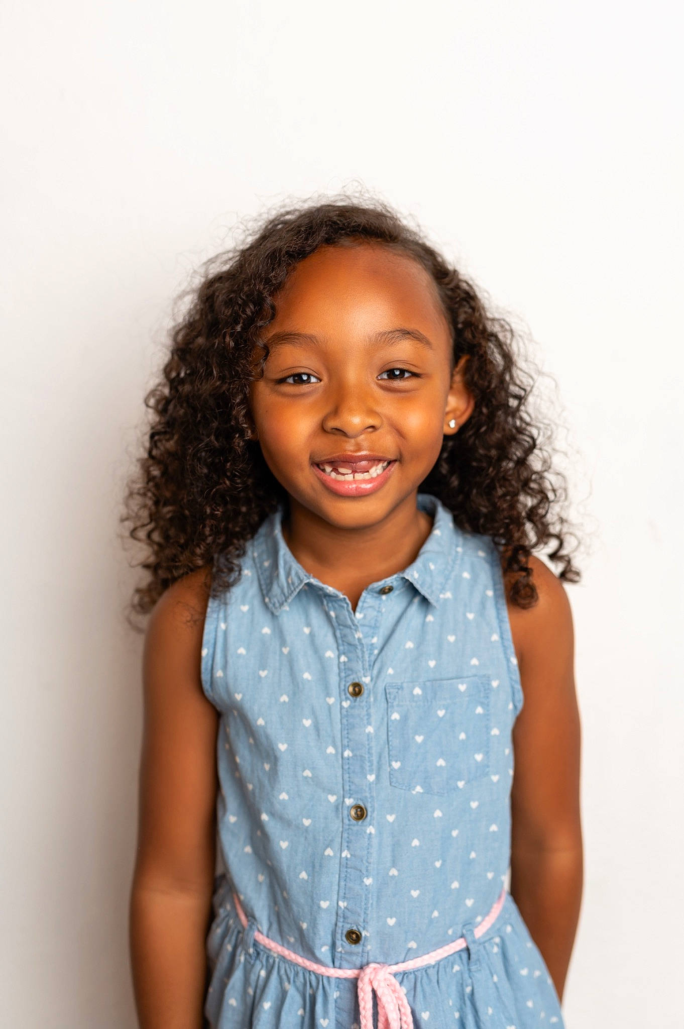 Ava is registered to the contest to win money with this photo: arm, baby_toddler_clothing, cheek, chin, dress_shirt, face, facial_expression, fashion, hairstyle, happy, human, human_body, joy, lip, neck, nose, person, shoulder, skin, sleeve