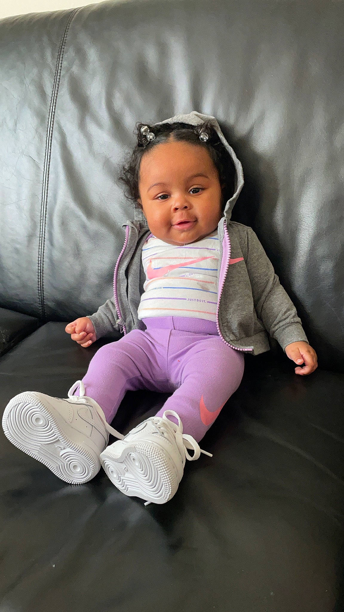 Milan is registered to the contest to win money with this photo: baby, baby_toddler_clothing, child, comfort, couch, foot, goggles, lap, person, shoe, sitting, sneakers, sock, toddler, walking_shoe