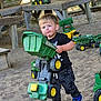 boy, child, clothing, face, footwear, grass, head, machine, male, outdoorplayarea, outdoors, person, photography, plant, playarea, portrait, shoe, toy, wheel, wood