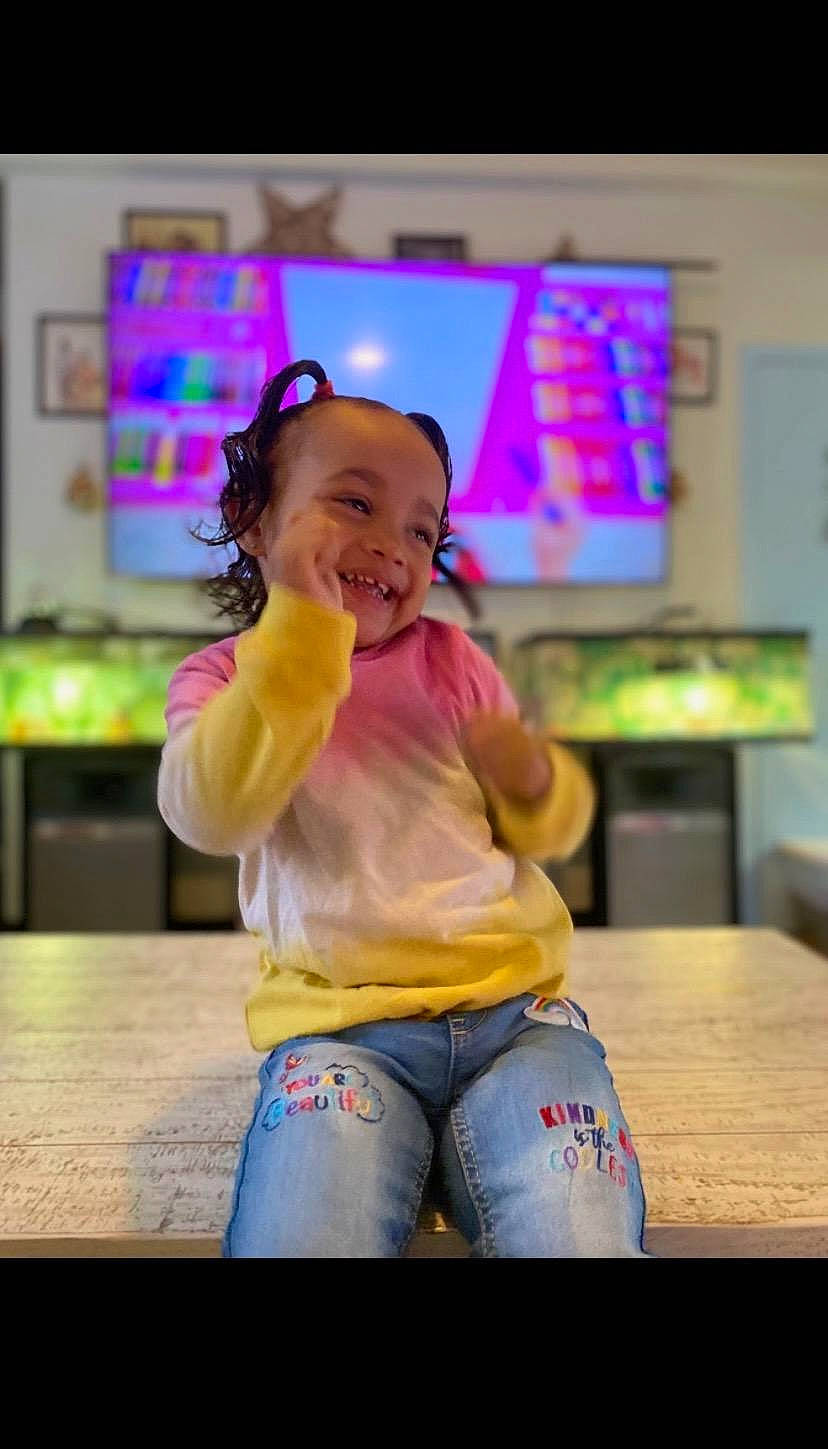 Azalee joined the competition — help win amazing prizes! child, entertainment, event, flooring, fun, happy, jeans, joy, leisure, magenta, person, play, purple, recreation, room, sitting, smile, snapshot, t_shirt, table