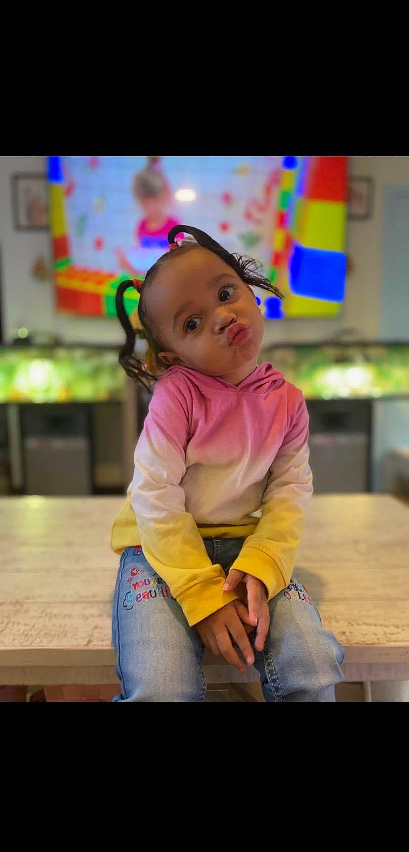 Azalee is registered to the contest to win money with this photo: chair, cheek, child, event, flooring, fun, happy, kindergarten, leisure, magenta, person, play, portrait_photography, recreation, room, sitting, skin, smile, table, toddler