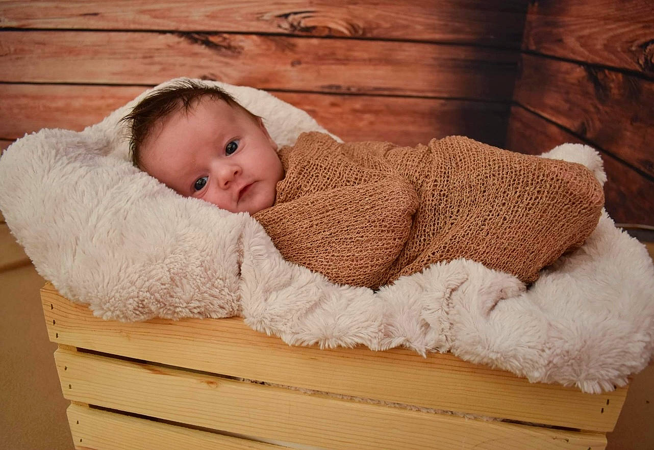 Carter joined the competition — help win amazing prizes! art, baby, baby_sleeping, baby_toddler_clothing, child, comfort, fashion_accessory, fur, hardwood, headgear, linens, person, portrait_photography, product, rectangle, room, sitting, toddler, wood, wool
