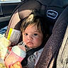 Payton joined the competition — help win amazing prizes! baby, car_seat, bottle, infant, child, seatbelt, sunlight, window, car_interior, blanket, clothing, face, hand, hair, person, portrait, expression, sitting, indoors, evenflo