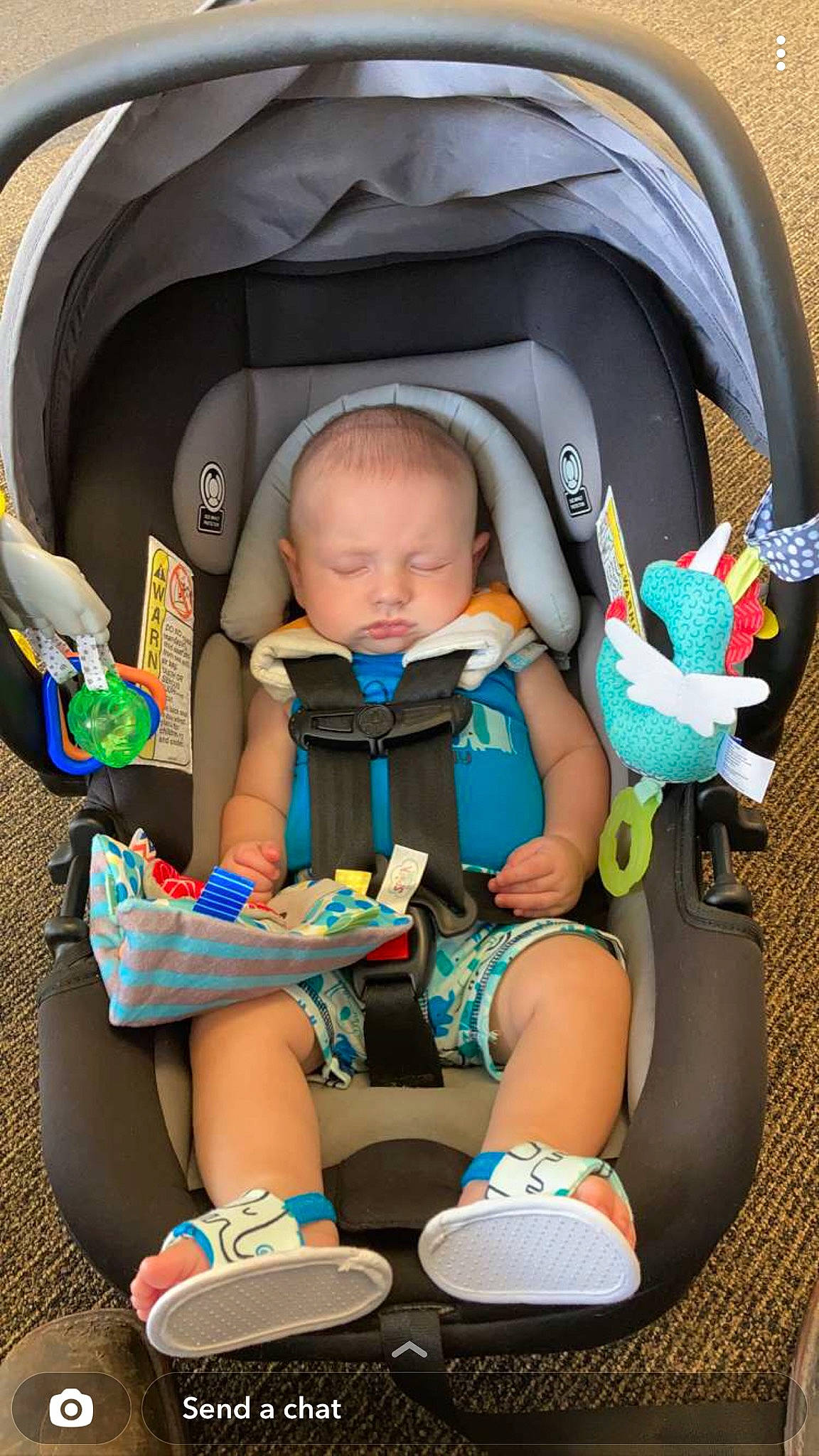 Brycen is registered to the contest to win money with this photo: baby, baby_carriage, baby_products, baby_safety, baby_toddler_clothing, bag, car_seat, child, comfort, electric_blue, eye, fun, green, person, photograph, shorts, sitting, toddler, travel, vacation