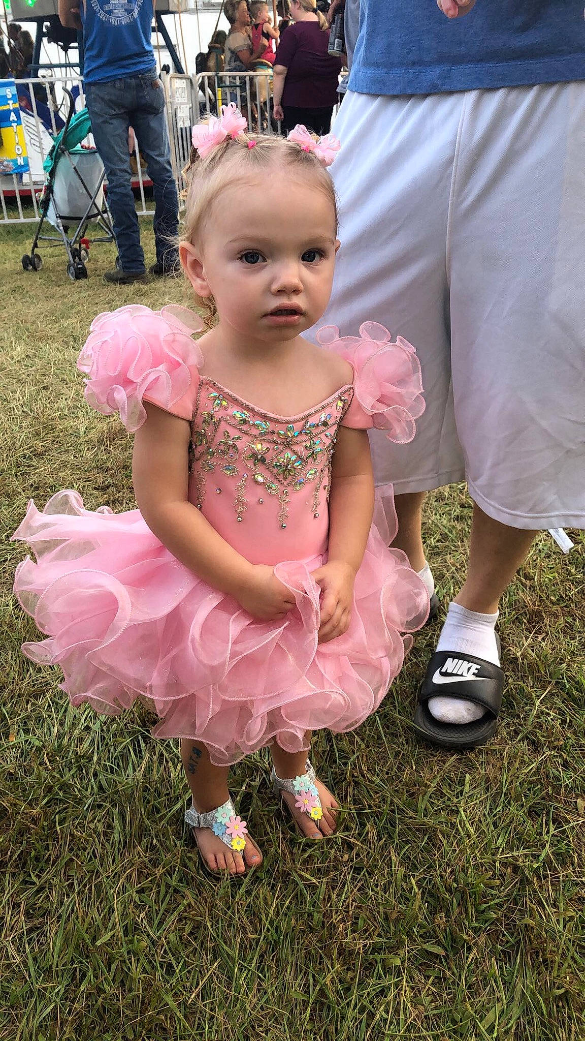 Miraya is registered to the contest to win money with this photo: baby, baby_toddler_clothing, child, dress, event, footwear, fun, grass, happy, hat, jewellery, magenta, person, pink, recreation, sandal, shoe, shorts, sneakers, toddler