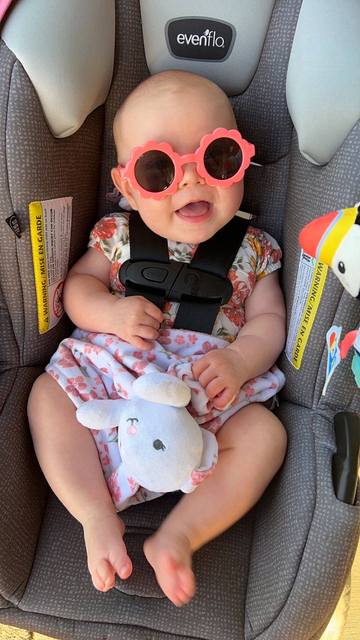 Odette is registered to the contest to win money with this photo: auto_part, automotive_design, baby, baby_toddler_clothing, car_seat, car_seat_cover, carmine, child, comfort, eyewear, glasses, goggles, head_restraint, lap, person, personal_protective_equipment, sunglasses, thigh, toddler, vision_care