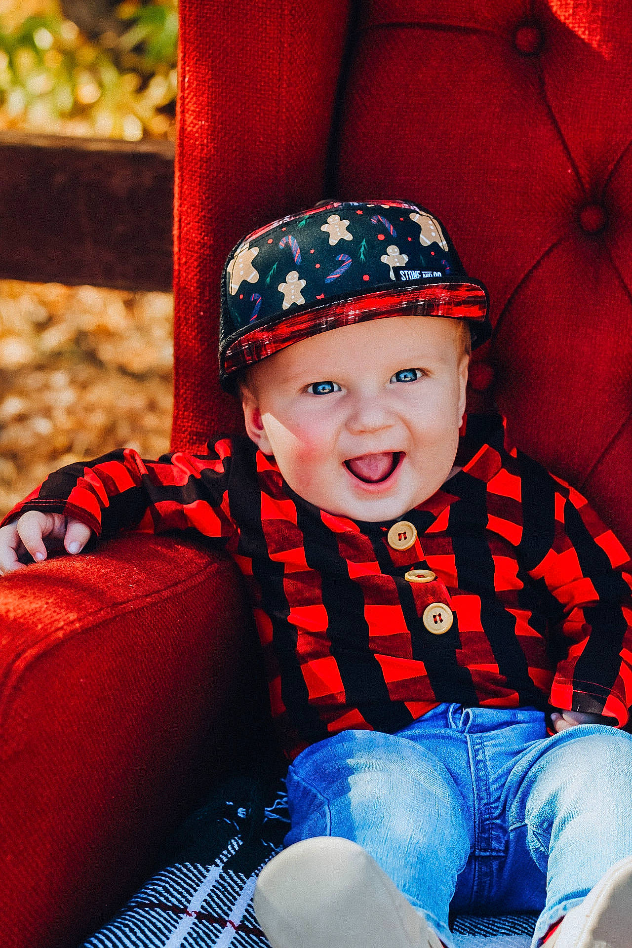 Kannon is registered to the contest to win money with this photo: baby, baby_products, baby_toddler_clothing, carmine, cheek, child, child_model, costume_accessory, costume_hat, eye, headgear, headwear, laugh, mouth, nose, pattern, person, photo_shoot, red, sitting