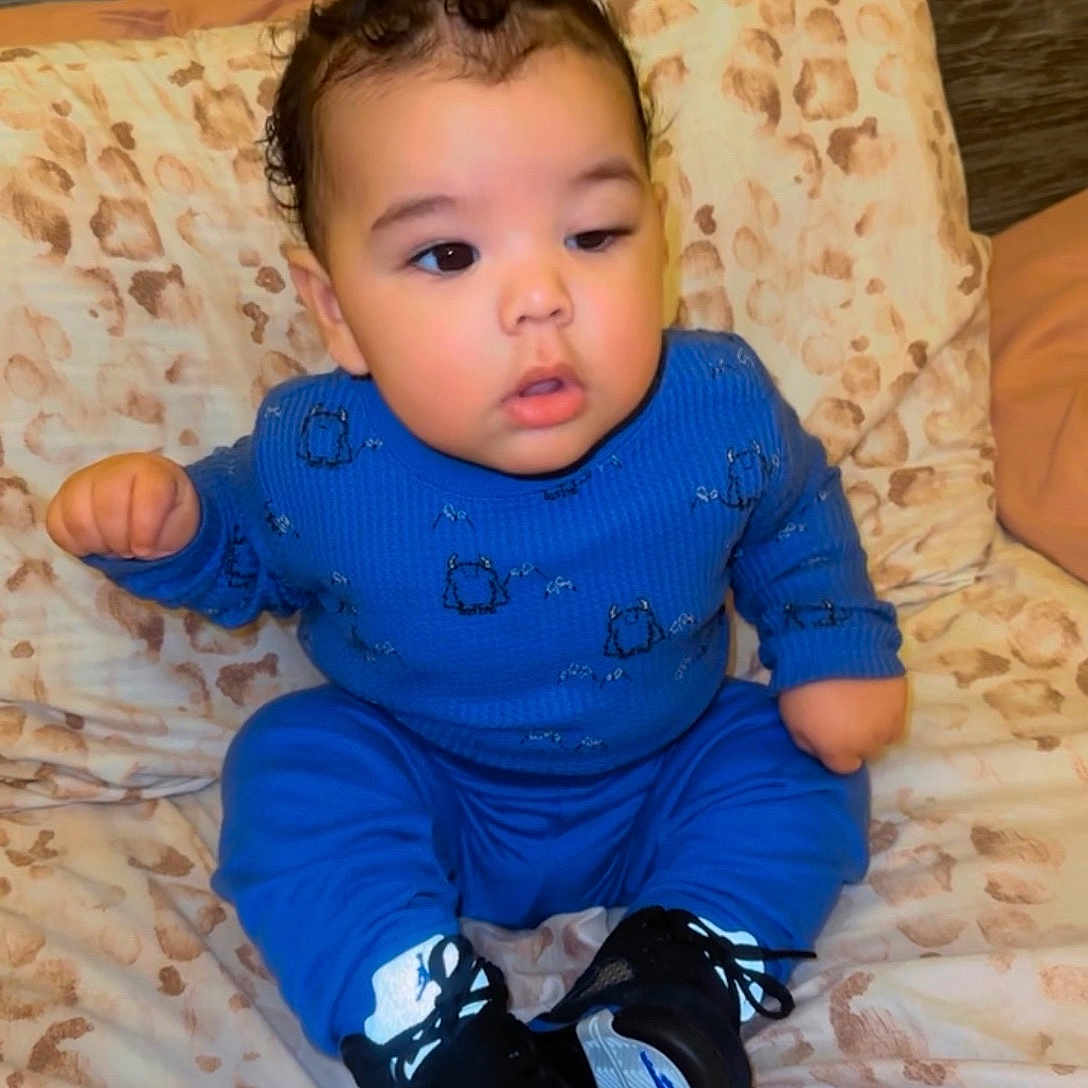 Neteyam joined the competition — help win amazing prizes! baby, bed, bedroom, clothing, couch, cushion, face, footwear, furniture, head, homedecor, indoors, pants, person, photography, portrait, room, shoe, shorts, sitting