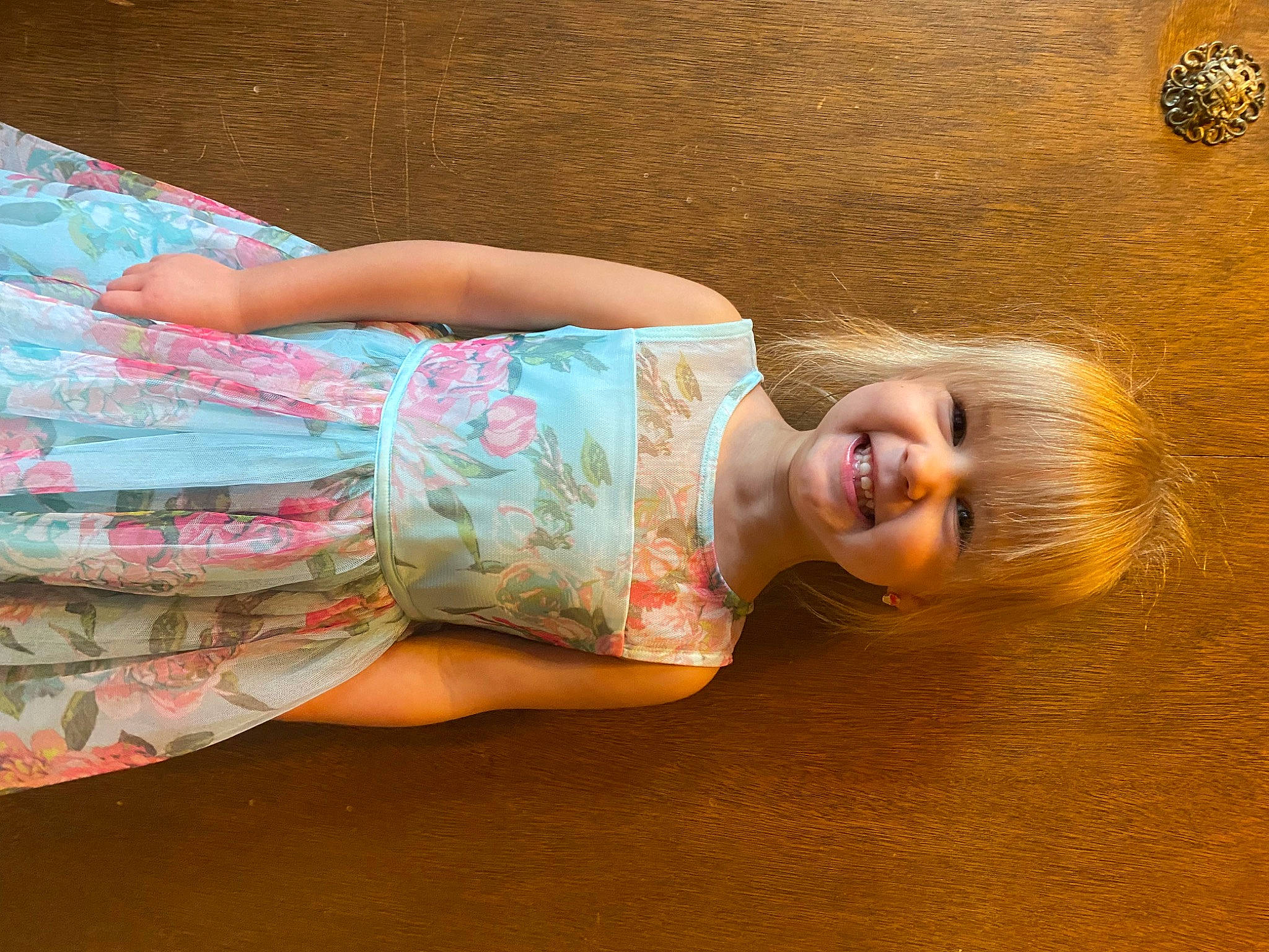 Khloey is registered to the contest to win money with this photo: abdomen, blond, child, elbow, finger, flooring, happy, hardwood, human_body, human_leg, joint, joy, leisure, long_hair, person, skin, smile, textile, thigh, toddler