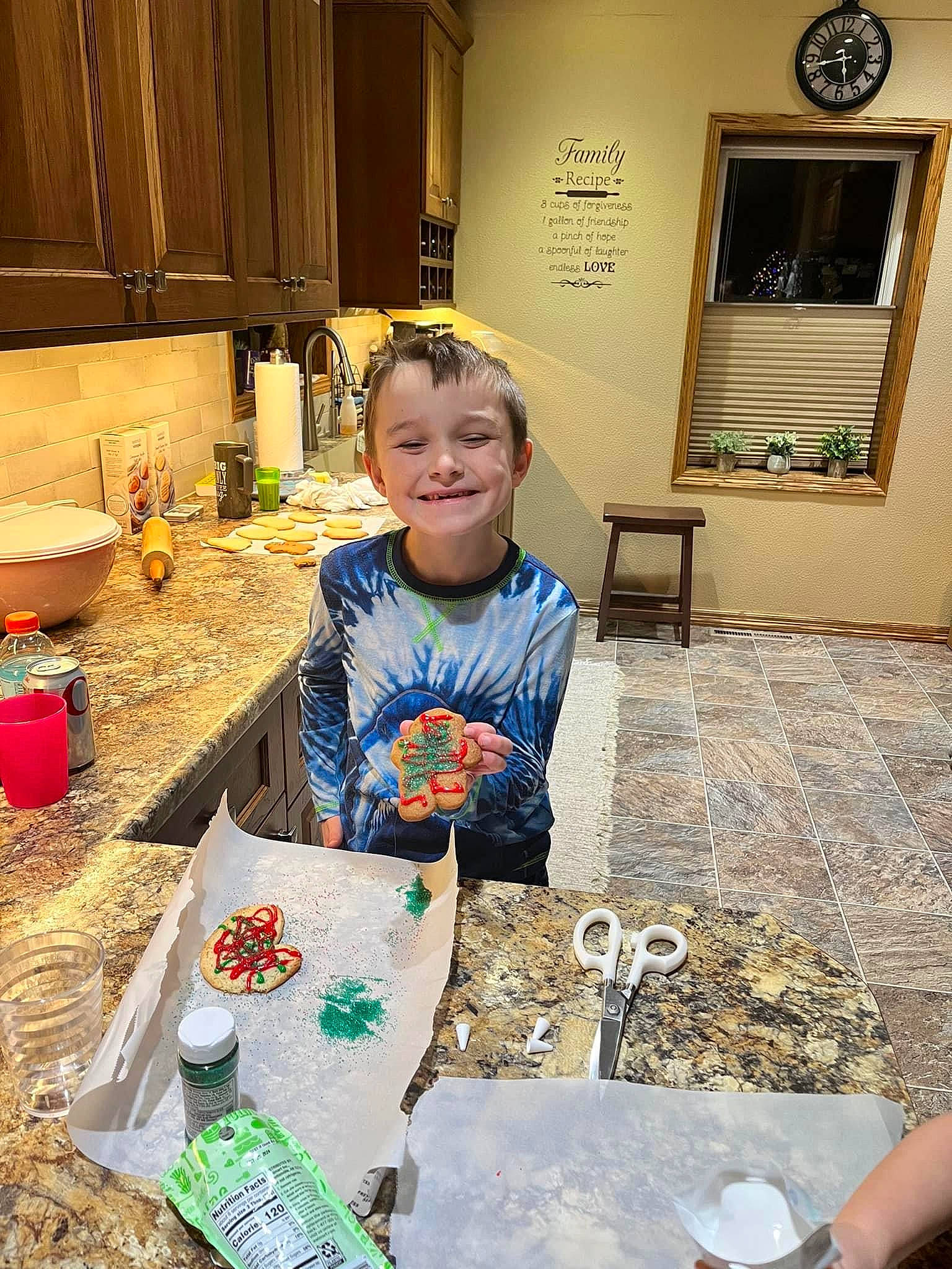 Kyler joined the competition — help win amazing prizes! cabinetry, chair, child, christmas, comfort_food, cooking, event, flooring, fun, holiday, joy, kitchen, person, picture_frame, play, room, sitting, smile, t_shirt, table
