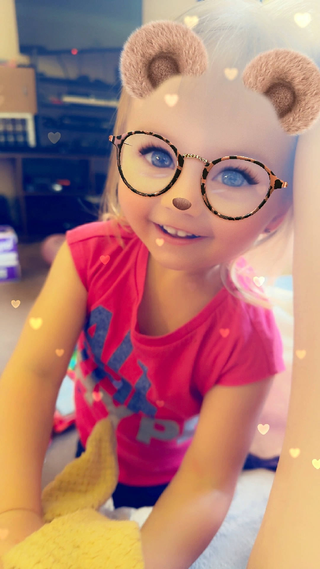 Karley is registered to the contest to win money with this photo: accessories, bodypart, child, clothing, doll, face, female, finger, girl, glasses, hand, head, indoors, person, photography, portrait, purple, sunglasses, t_shirt, toy