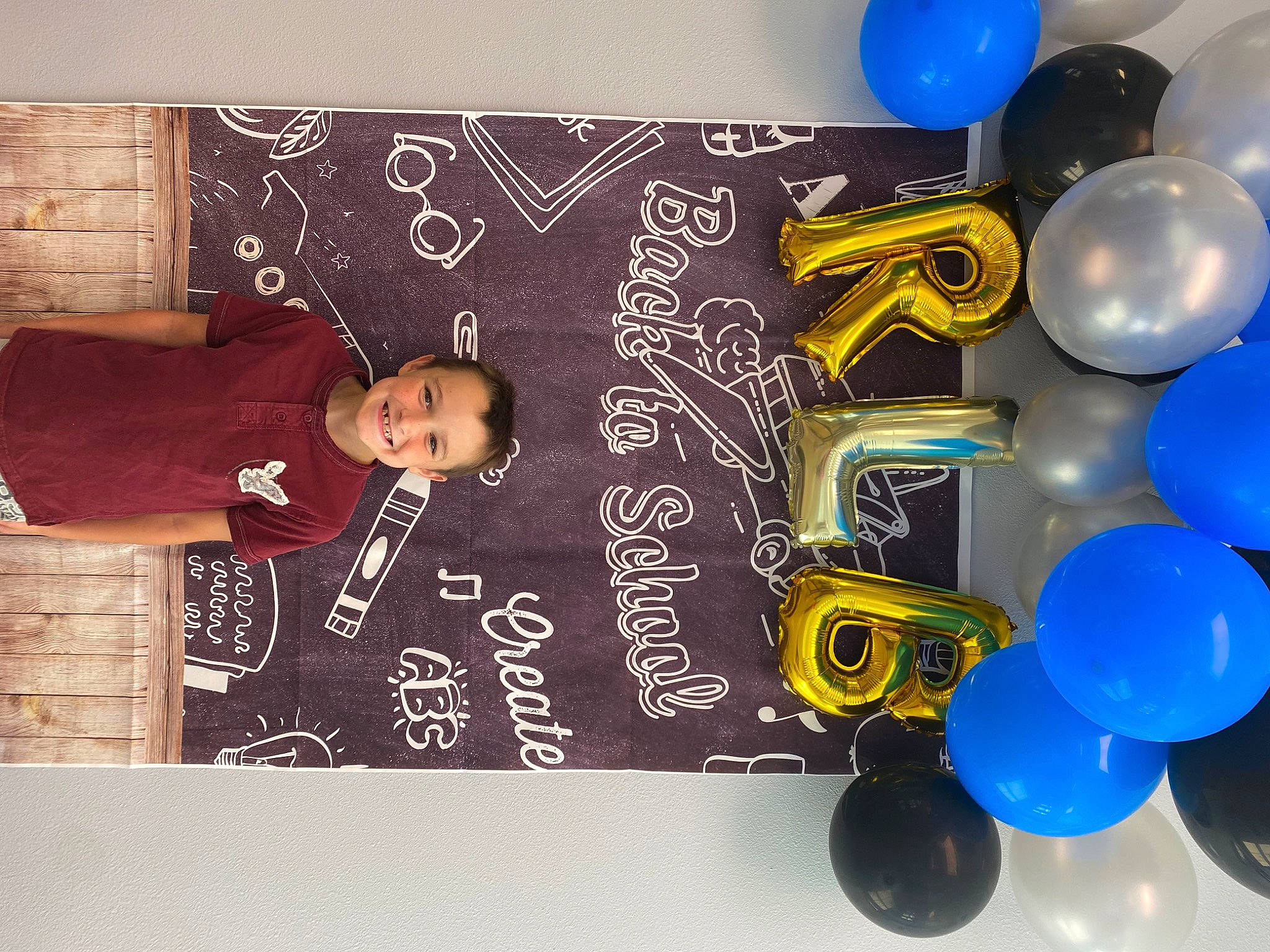 Kyler is registered to the contest to win money with this photo: advertising, art, balloon, circle, electric_blue, event, font, graphic_design, graphics, happy, joy, material_property, party_supply, pattern, person, room, space, visual_arts