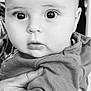 baby, infant, child, face, eyes, hand, clothing, portrait, black_and_white, cute, expression, person, young, holding, closeup, skin, eyelashes, nose, mouth, indoor