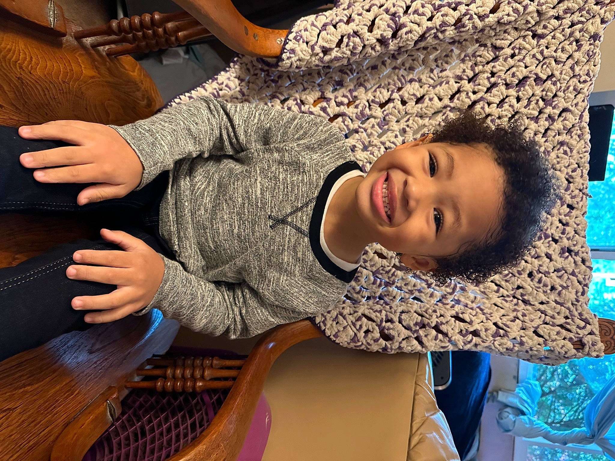 Apollo is registered to the contest to win money with this photo: audio_equipment, chair, child, flooring, fun, guitar, happy, human_leg, joy, leisure, mouth, musical_instrument, nail, pattern, person, room, sitting, smile, thigh, thumb