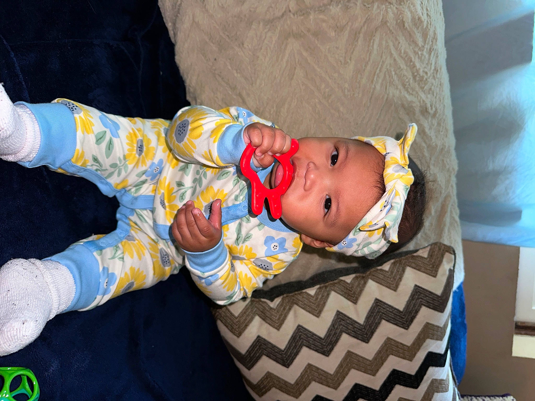 Artemis-sage is registered to the contest to win money with this photo: baby, baby_products, baby_toddler_clothing, child, comfort, face, fun, hand, hat, headwear, pattern, person, room, sitting, sleeve, toddler