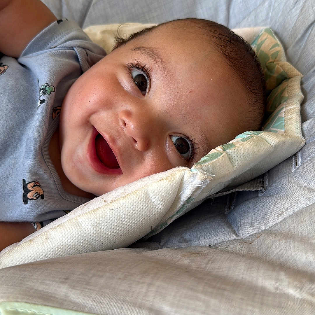 Liam joined the competition — help win amazing prizes! baby, baby_seat, cheeks, child, clothing, cushion, cute, eyelashes, face, happy, head, indoor, infant, mouth, portrait, relaxing, seat, skin, smiling, young