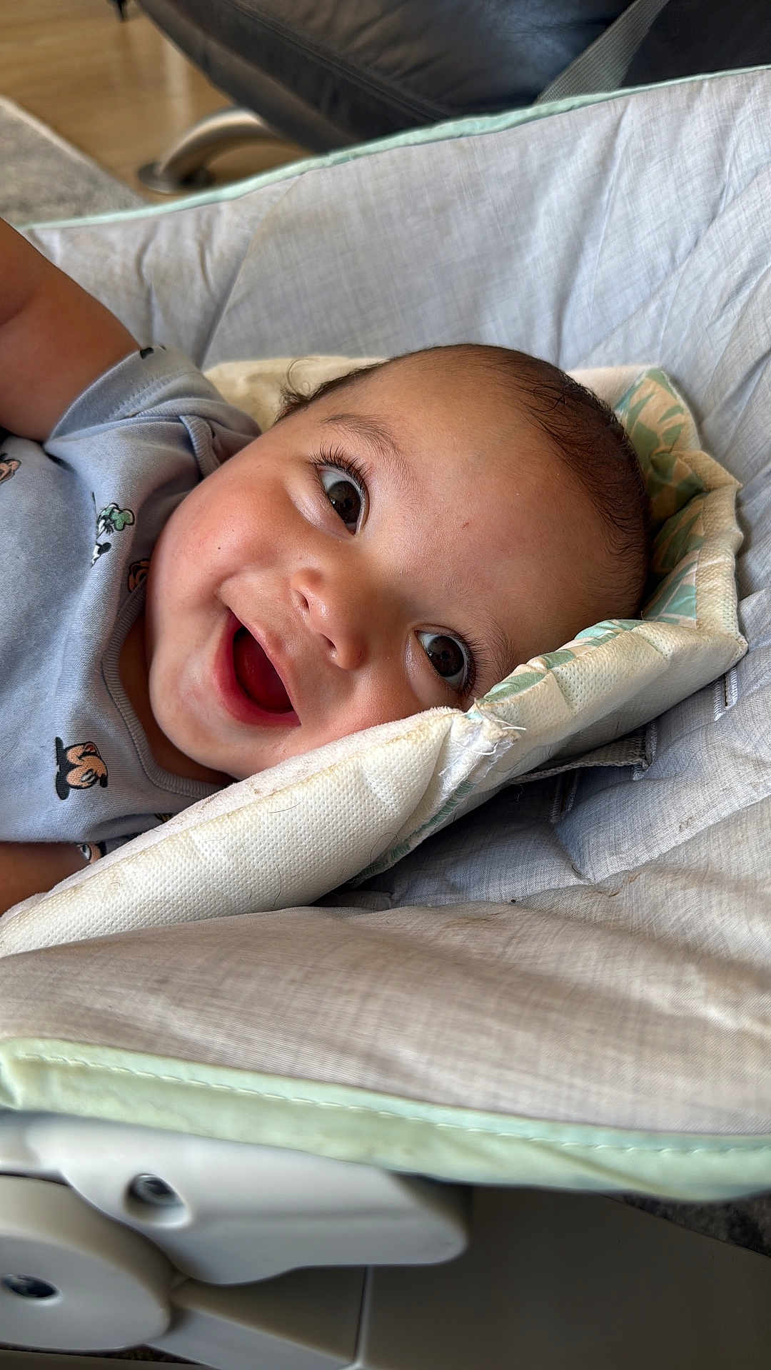 Liam joined the competition — help win amazing prizes! baby, smiling, face, infant, child, happy, cushion, seat, clothing, indoor, portrait, skin, head, eyelashes, mouth, cheeks, baby_seat, cute, young, relaxing