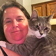 Mochi is registered to the contest to win money with this photo: cat, closeup, cozy, eyes, face, fur, furniture, holding, home, hug, indoor, kitchen, person, pet, portrait, selfie, shoulder, smile, whiskers, wooden_cabinet